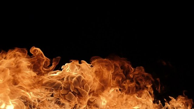 Slow motion of realistic fire blast on black background