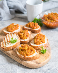 Toasted bread with vegetable caviar, made of squash, pumpkin, tomato, carrot