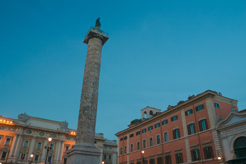 Italian Piazza Colonna with Roman Doric Column of Marcus Aurelius in dusk Rome