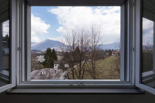 Landscape seen from the private apartment window, open window