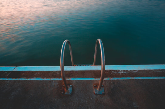 Close-up of metal steps into the ocean baths, Merewether, New South Wales, Australia