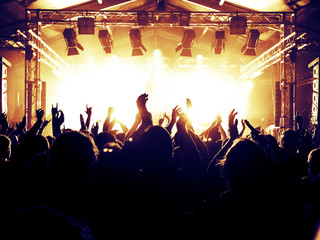 Concert stage with many fans