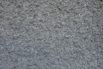 The image of the wall, plastered small stone for use as a background.