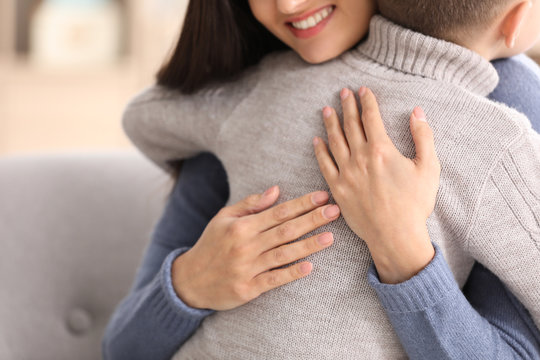 Woman Hugging Little Boy Indoors. Child Adoption