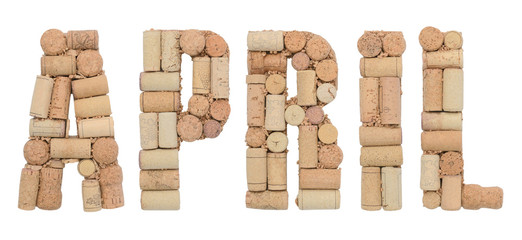 Word April made of wine corks Isolated on white background