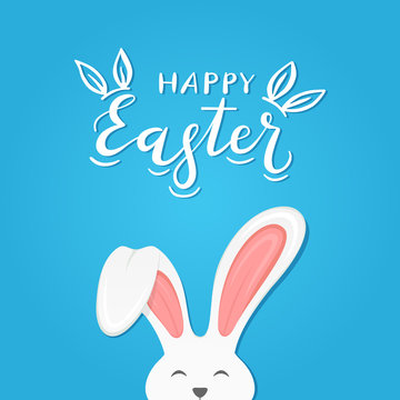 Blue background with text Happy Easter and rabbit ears