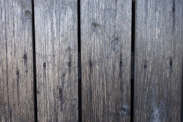 Fototapeta premium Old plank wooden wall background. The texture of old wood. Weathered piece of wood.