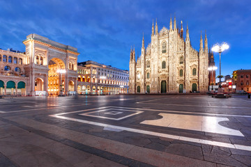 Panorama of the Piazza del Duomo, Cathedral Square, with Milan Cathedral or Duomo di Milano and Galleria Vittorio Emanuele II, during morning blue hour, Milan, Lombardia, Italy © Kavalenkava