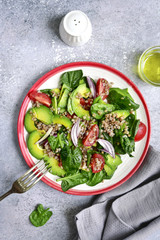 Vegetable sald with avocado, baby spinach, tomato and buckwheat.Top view.