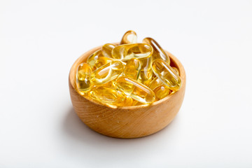 Fish oil capsules with omega 3 and vitamin D. healthy diet concept.