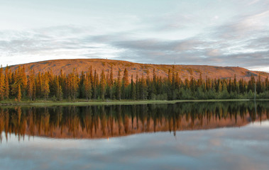 Midnight sun colouring the Luosto mountain in Lapland, Finland