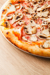 Pizza close up on a wooden table