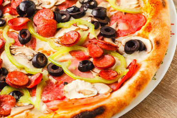 Pizza close up on a wooden table