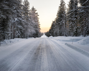 Winter landscape.Empty road covered with ice.
