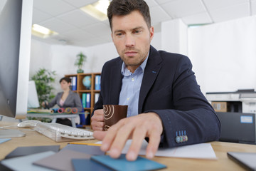 businessman in office checking colours