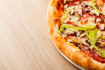 Pizza close up on a wooden table