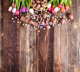 chocolate rabbit, easter eggs and tulips