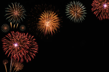 Brightly colorful fireworks in the evening sky background