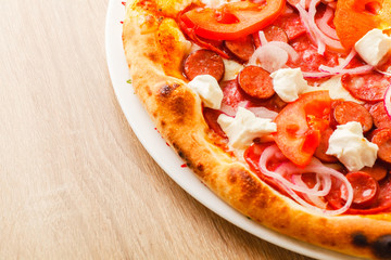 Pizza close up on a wooden table