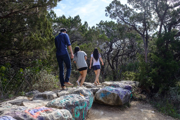 Unknown people go hiking near 360 bridge in Austin TX