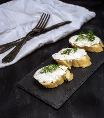 sandwiches with white cream cheese on a slice of bread