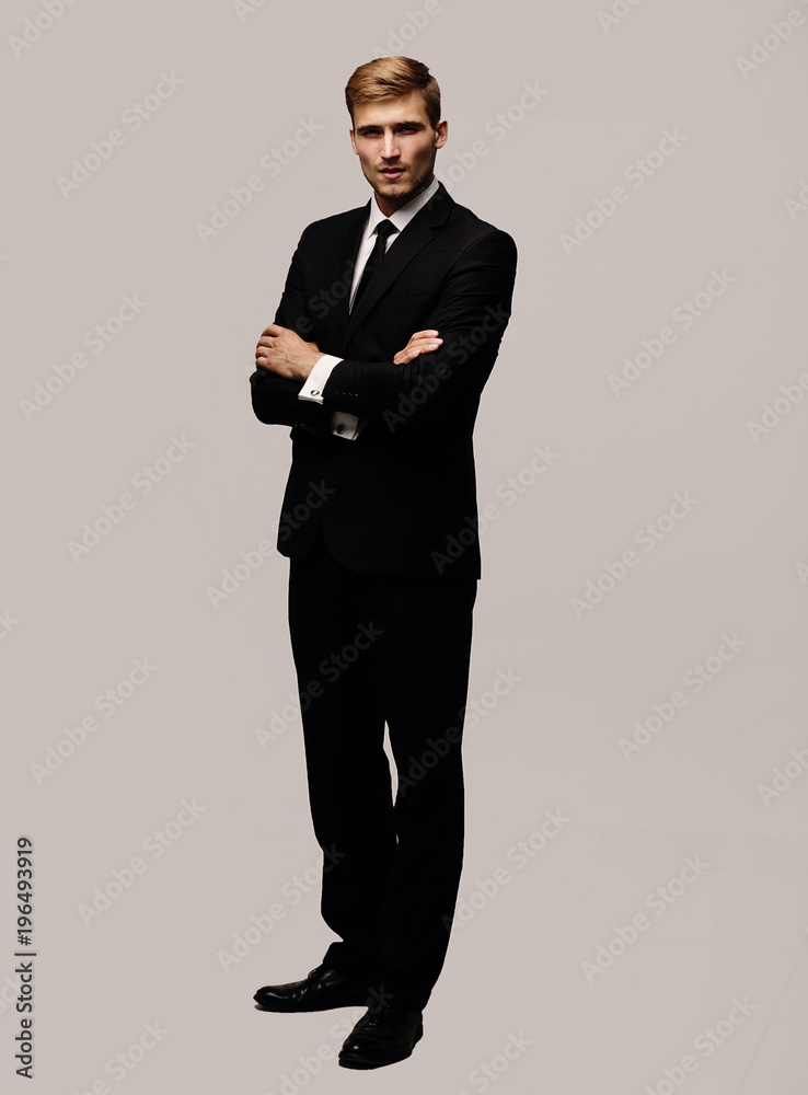 Poster portrait in full growth serious businessman.