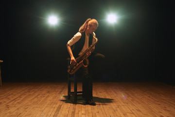The girl playing the saxophone