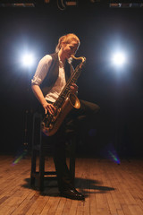 The girl playing the saxophone