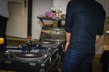 DJ was playing music with vinyl plates