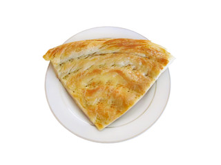 Traditional Flatbread of Central Asia on dish, selective focus and isolated on white background.