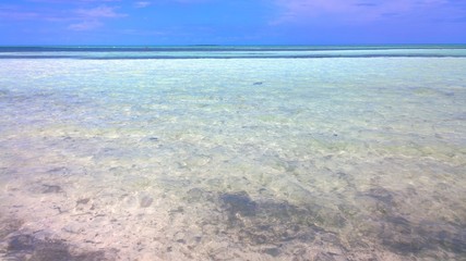 Turquoise water of Atlantic ocean, clouds and blue sky. Cayo Guillermo, Cuba