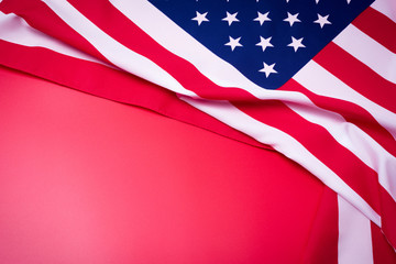 Closeup of American flag on red background.