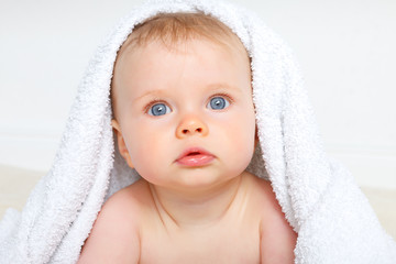 baby under a towel