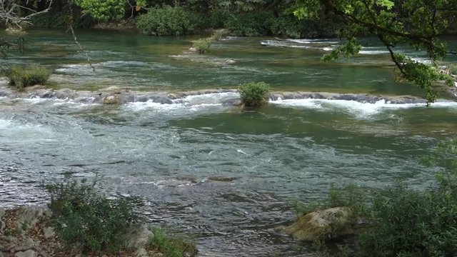 The Macal River flows through Belize.