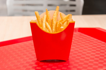 French fries in red box on a tray