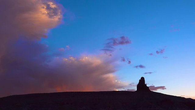 Beautiful rain clouds rolling above buttes near Monument Valley, Utah.