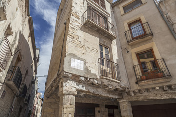 Fototapeta na wymiar Street view, ancient facade houses in medieval village of Santa Coloma de Queralt, province Tarragona,Catalonia.Spain.