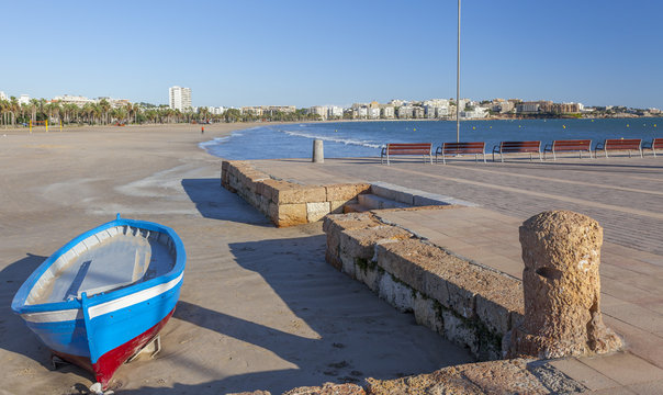Mediterranean beach and fishing boats in catalan town of Salou, Costa Daruada, province Tarragona,Catalonia.Spain.