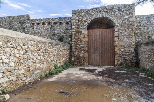 Door entrance of ancient military construction, Forti de la Reina, Queen fortress in Tarragona, Costa Daurada, Catalonia, Spain.