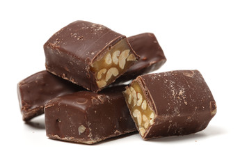 Chocolate peanut candy on white background