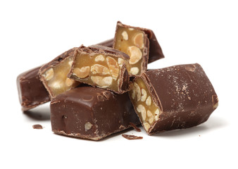 Chocolate peanut candy on white background