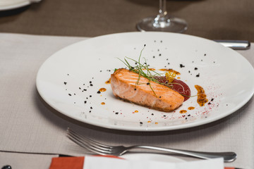 delicious salmon in a restaurant. small portion