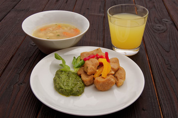 Batato gnocchi with pesto on a table