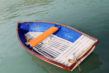Fototapeta na wymiar Old wooden boat on the lake