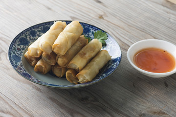 Lumpia Spring Rolls on Wooden Table in Restaurant