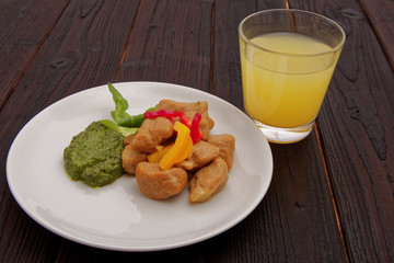 Batato gnocchi with pesto on a table