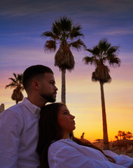 Couple young in beach vacation sunrise