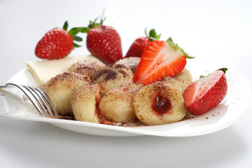 Delicious sweet dumplings stuffed with strawberries and cocoa