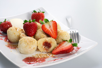 Delicious sweet dumplings stuffed with strawberries