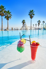 Tropical cocktails in resort infinity pool